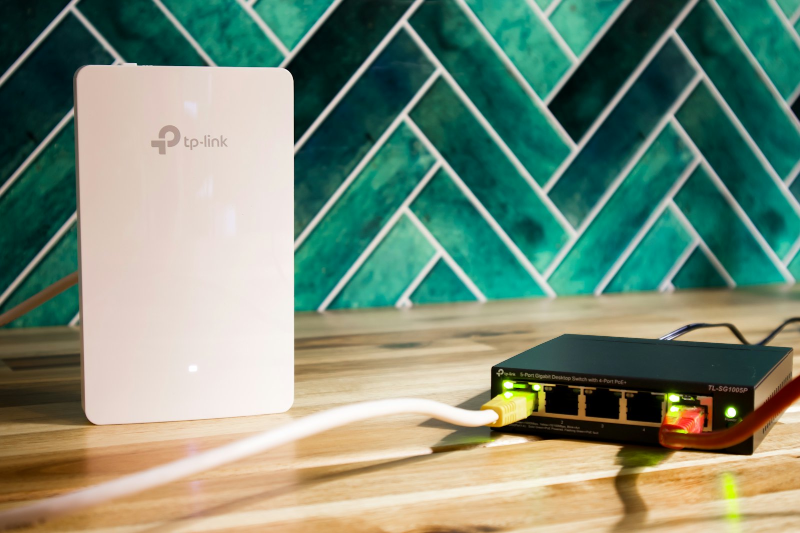 A wireless access point and network switch with cables connected